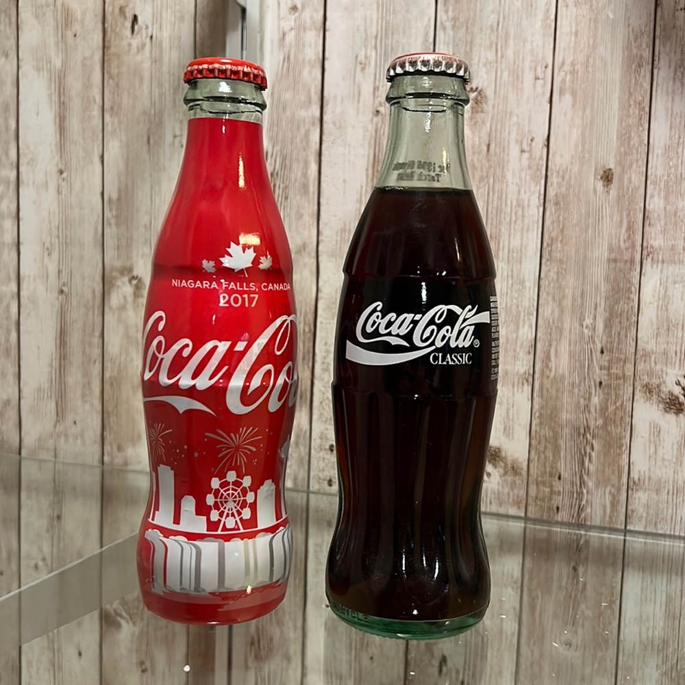 3 Coca Cola Collector Bottles.